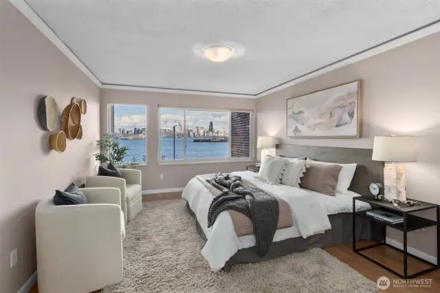 The primary bedroom faces downtown and Elliott Bay; fall asleep to the twinkling city lights and wake up to the sunrise over the Cascades!