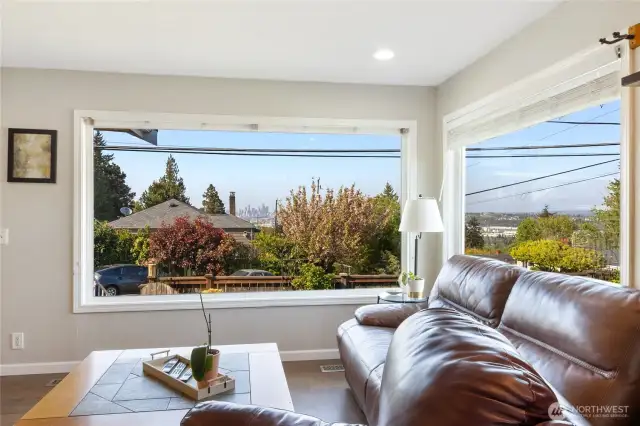 Huge windows overlook sweeping Seattle & Bellevue views