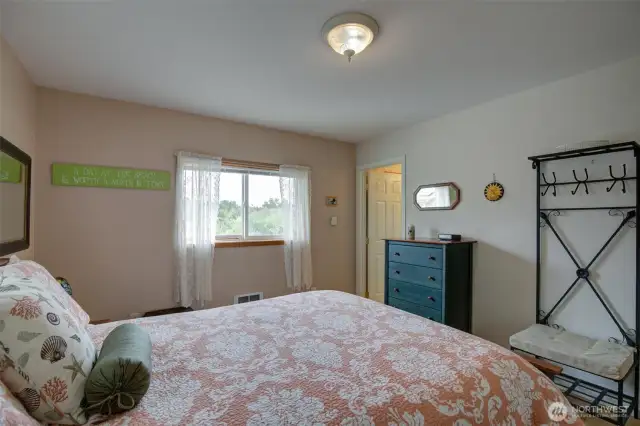 Main bedroom with the door leading to the bathroom.