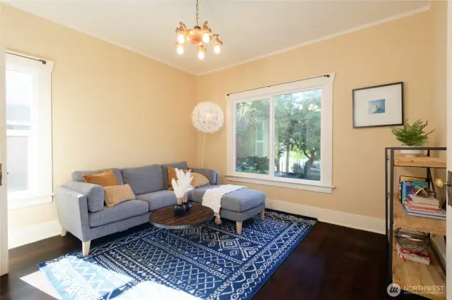 The main floor en suite, with it's pass-through separate entrance to the courtyard and back porch and attached 3/4 bath, is ideal as a guest room or office.