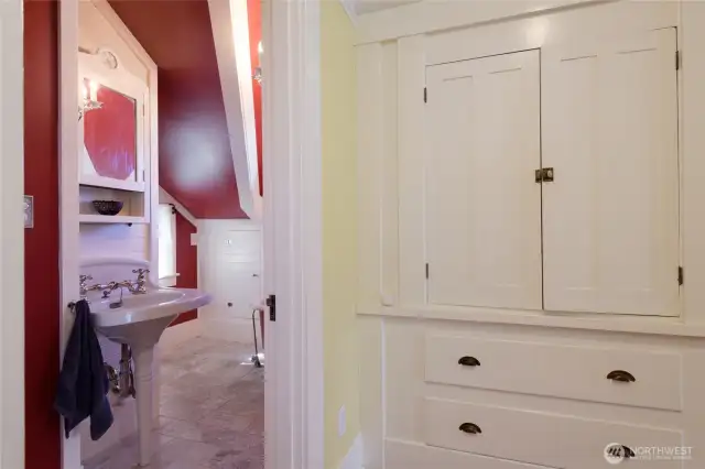 Head upstairs and at the top of the steps is the shared full bath. Vaulted ceilings throughout, make the upstairs an architecturally intriguing space, full of cozy corners and alcoves.