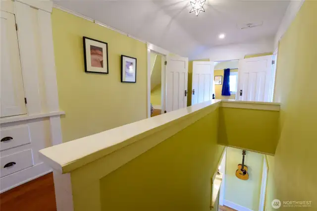 This is the view from the top of the stairs. Behind is the shared bath. First door on the left is the dormered bedroom No 1. Straight ahead is Bedroom No. 2. The open door on the right leads to the Main Bedroom.