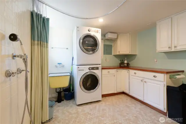 This is the laundry and pup washing station. Functioning like a mudroom, this space is designed so the dog-washing station can be removed, allowing cleanup from outdoors activities to take place without dragging the grubbies through the rest of the house.