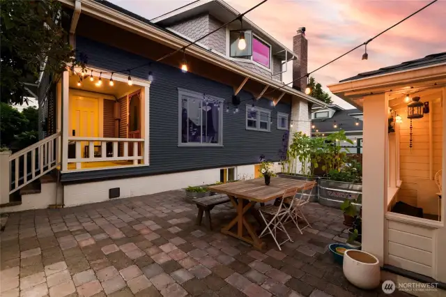 Stepping out the back door from the kitchen or the main floor en suite will land you in the courtyard. Shared with the 570sf DADU cottage, this space is lined with pavers for easy maintenance. An outstanding entertaining space for our PNW summers, the courtyard also takes you to the detached 1-car garage.