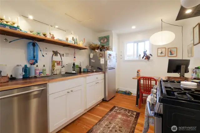 Walk through the front door of the cottage, into this cozy kitchen. There is a tenant here on a month-to-month lease, who would like to stay.