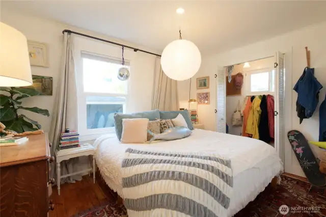 The cottage bedroom is adorably efficient.