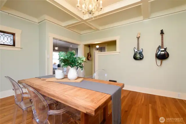 From the living room, you'll naturally gravitate toward the open dining room. Stepping through the short hall will take you into the kitchen, or straight ahead you'll enter the main floor en suite, which can function as a bedroom or an office.
