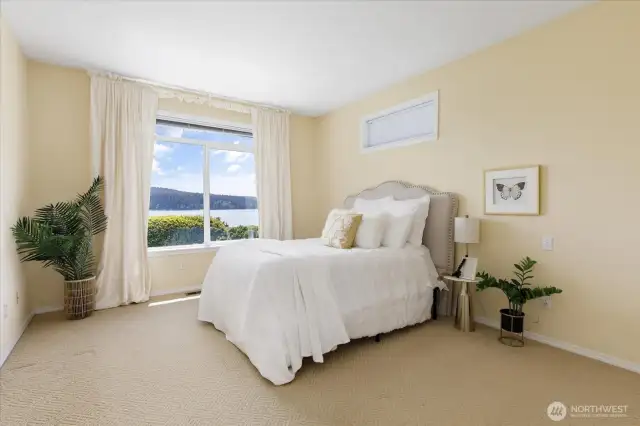 Gracious primary suite with sparkling water views!