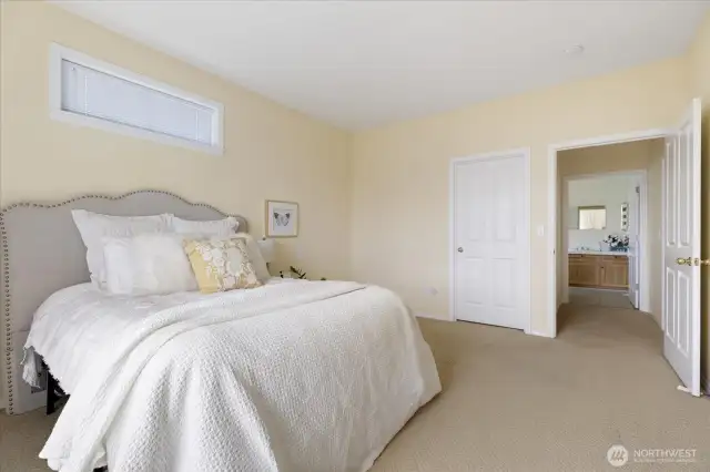 Primary suite with large walk-in closet & ensuite bathroom.