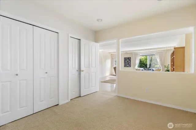 Office/bonus room space on the lower level has dual closets and a door in the closet leading to additional storage under the stairs.