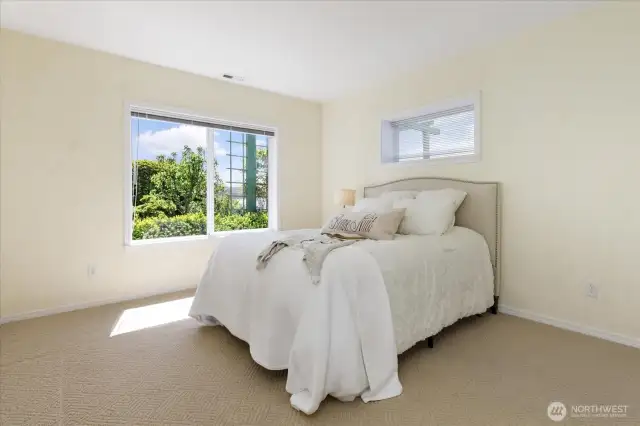 Generous sized lower level bedroom with water views.