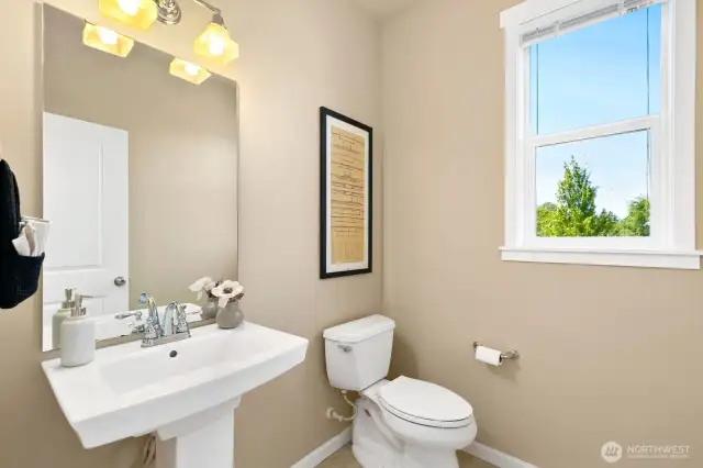 Spacious half bath off mud room.