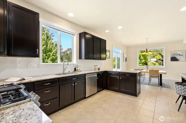 Another view of kitchen, looking back to dining space. Ample storage options in this space!