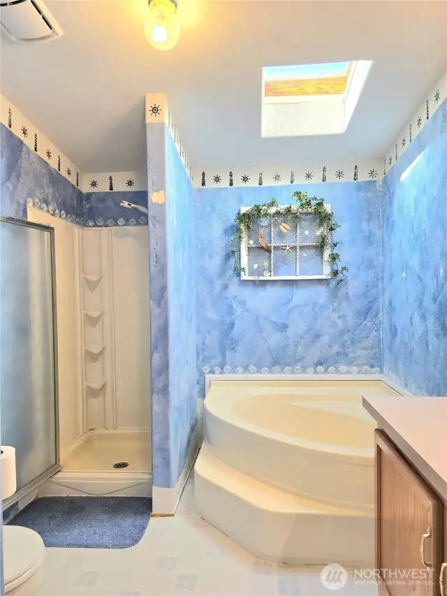Primary Bath with shower and soaking tub.