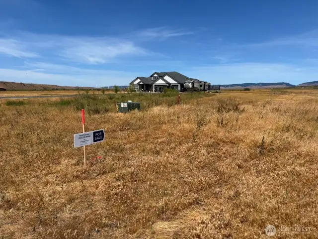 Flourescent tipped stake &  directional arrow are set on appx west boundary of this lot for reference on site.Lot served by Electric & it's own well.