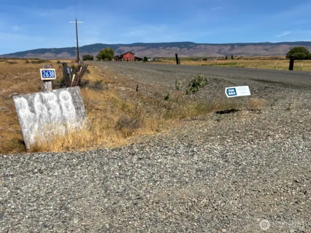 Entrance on the west side of Lower Green Canyon Road.The sign with 2638 refers to the house number of the last home on the access road(lot 5) which shares the west boundary of this lot.(lot 4)