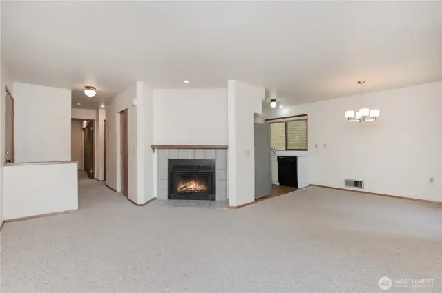 Step inside to a warm and inviting living room centered around a cozy fireplace.