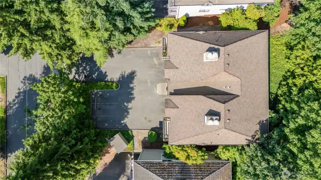 Aerial view highlighting the home and its surrounding landscape.