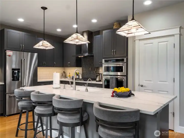 Barstools were custom made for this kitchen and can be purchased with the home if you so would like.