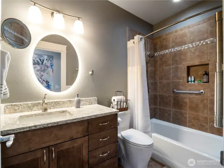 The guest bathroom has a soaking tub for your guests enjoyment.