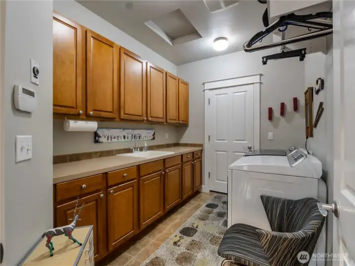 The oversized laundry room has oodles of storage too!