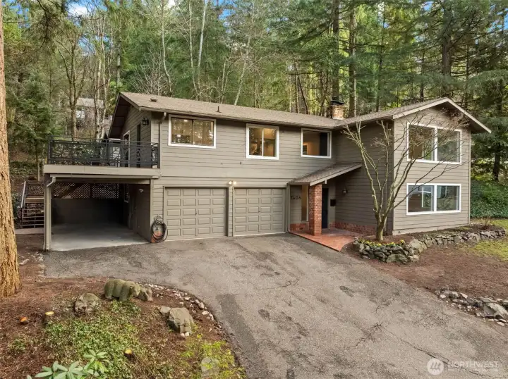 Refurbished Two Story Home located in small Gig Harbor neighborhood offers quiet and privacy. home included a two-car garage and covered carport.