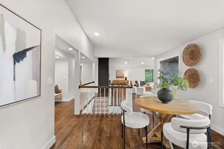 Open-concept design allows clear sightlines from kitchen to dining and living spaces.