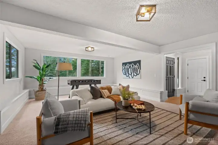 Spacious bonus room featuring large windows and plenty of natural light.