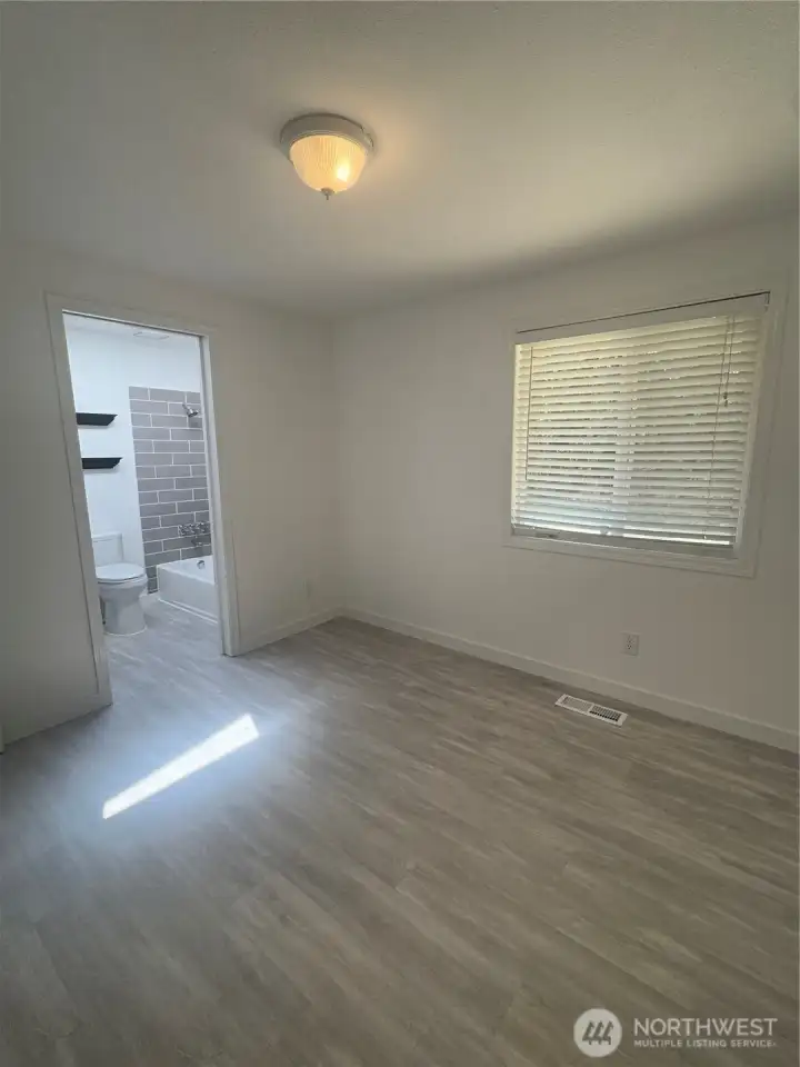 Bedroom (1) size 10' 5" x 9' 10.  Door to main bathroom.  Glass closet doors.