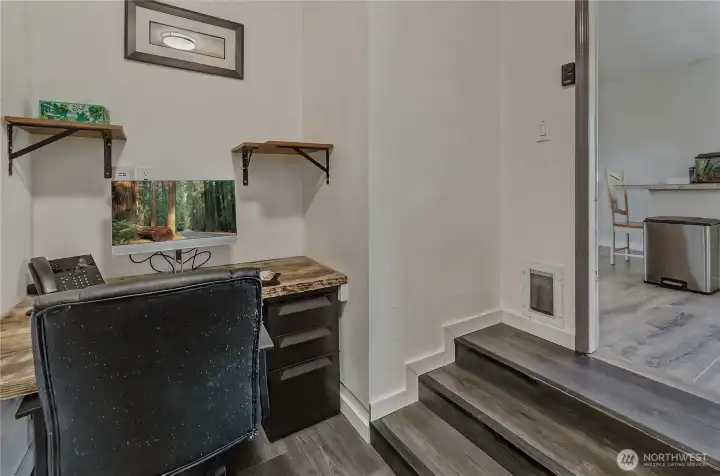Dedicated office space between kitchen and garage.