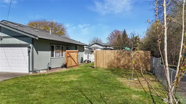 Over-sized side access gate to backyard.
