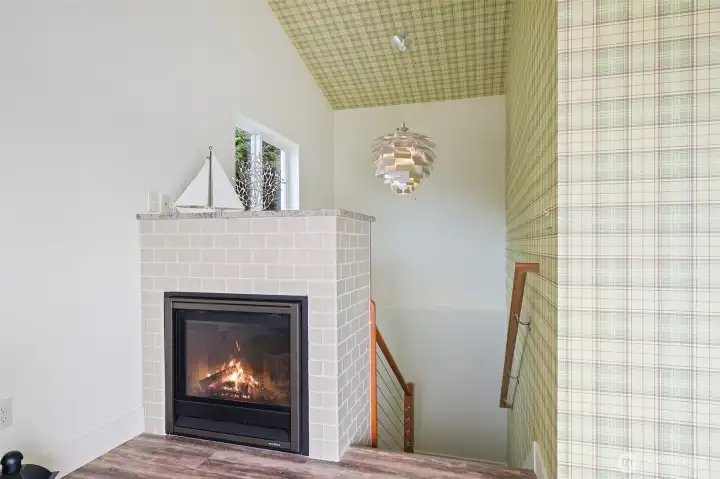 Stairwell with Beautiful Avocado Chandelier and Gorgeous Rail System.