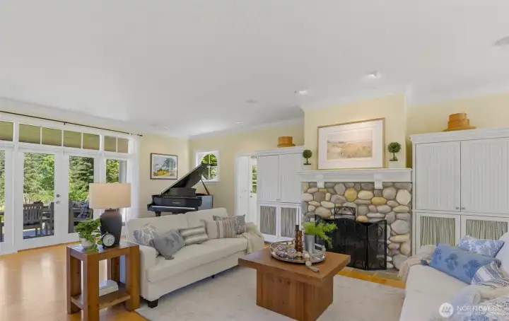 Living room anchored by stone fireplace