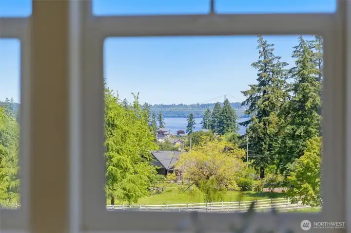Views from upper level window looking out over pastures, the Tacoma Narrows Bridge and beyond.
