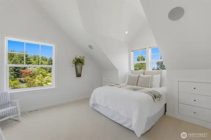 Bedroom 2 on upper level on view side of home with built-in storage drawers and dormer. Bedroom 2 on upper level on view side of home with built-in storage drawers and dormer.