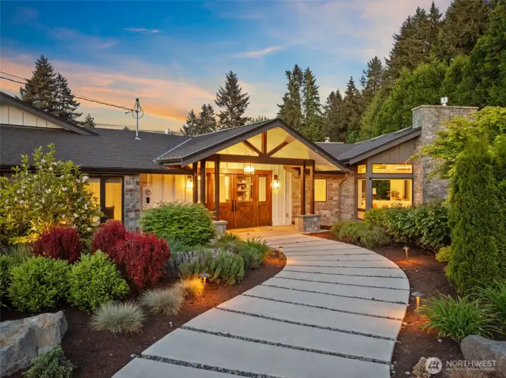 A Stone Walkway with Landscaped Lighting Guides you to the Front Entrance.