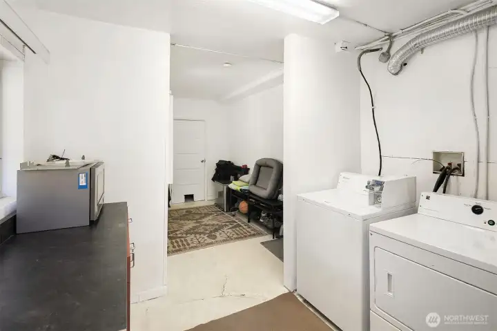 Metered Laundry Room & Storage for both units. Next to Entrance of Lower Unit