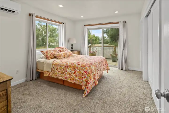 Primary bedroom with private deck Primary bedroom with private deck