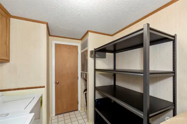 Laundry room. Shelving conveys.