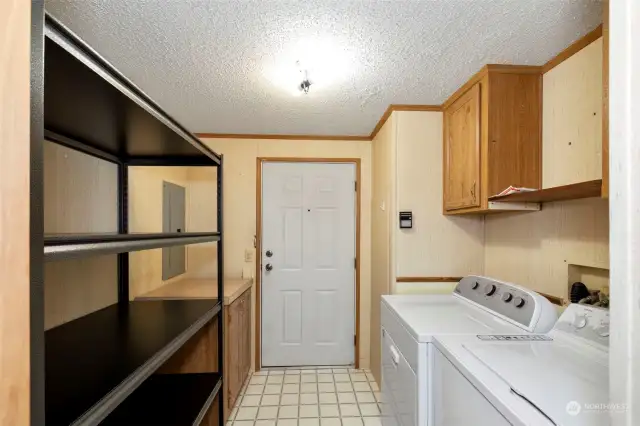 Laundry room. Shelving conveys.