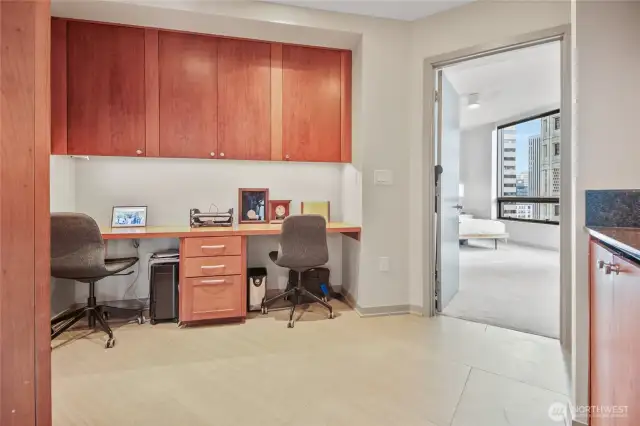 Second view of the office. The door leads to the primary sleeping space; the cabinets to your right house the washer and drawer.