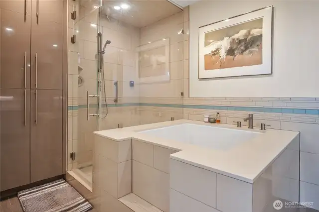 Large soaking tub adjacent to the spacious shower.