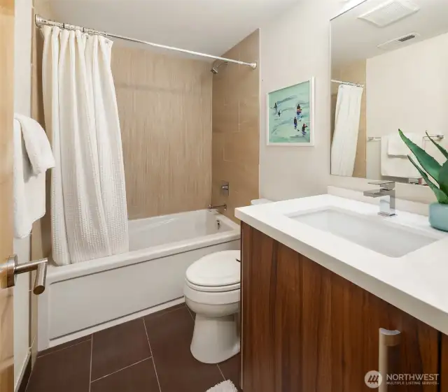This full bathroom is located on the lower level for convenience.