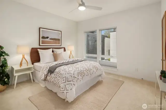 The 2nd bedroom, located on the upper level is roomy & sunny.