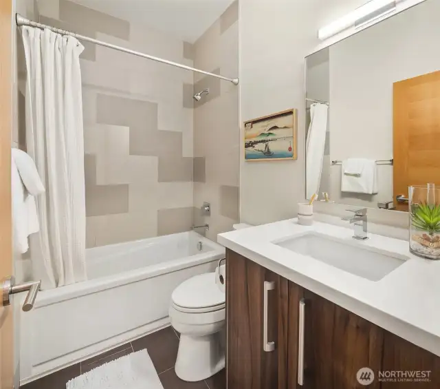 This full bathroom is complements the 2nd bedroom off the hallway.