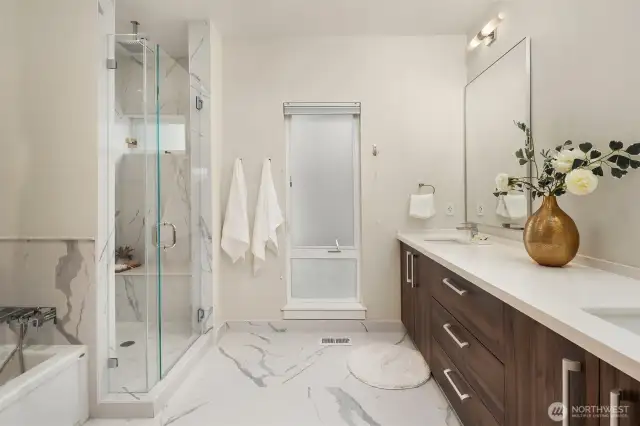 The seamless shower is beautiful. Privacy film as been added to this window.