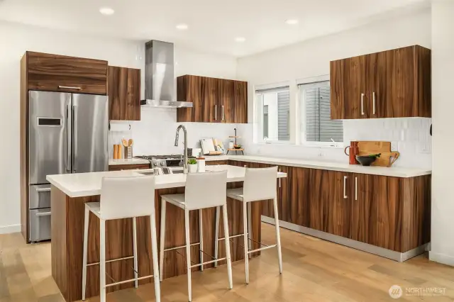 The rich color of the cabinet complement the stainless appliances.