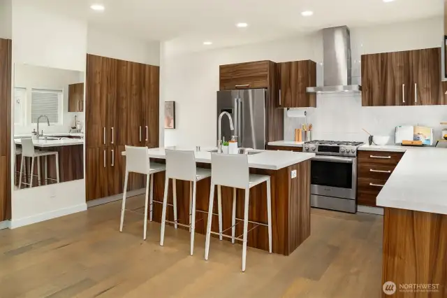 Extra seating at the island allows for easy entertaining between the kitchen & dining room.