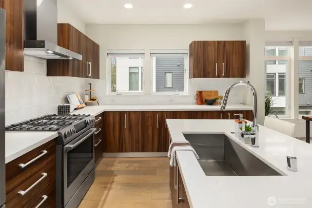 A deep sink and loads of counter space make the kitchen area functional for meal prep.