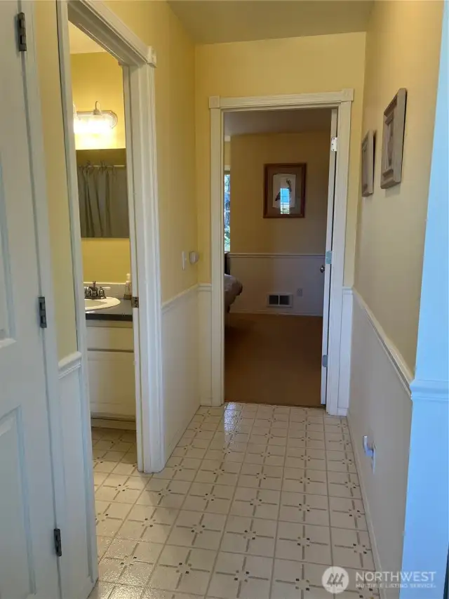 Hallway leads to the full bath and bedroom.